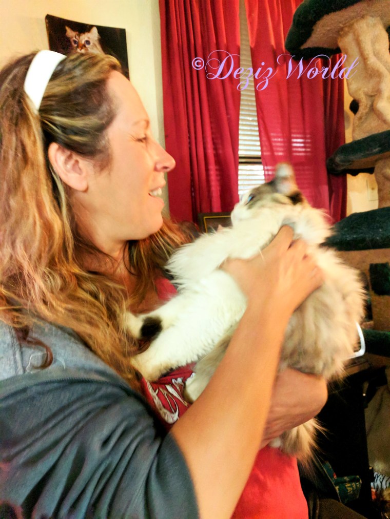 Mary Beth holds Raena while Raena looks at her