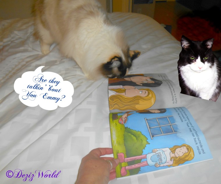 Raena and Emmy look at the book