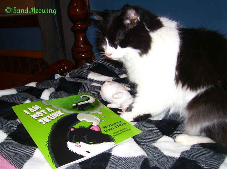 Emmy sits with her new book I'm Not A Skunk